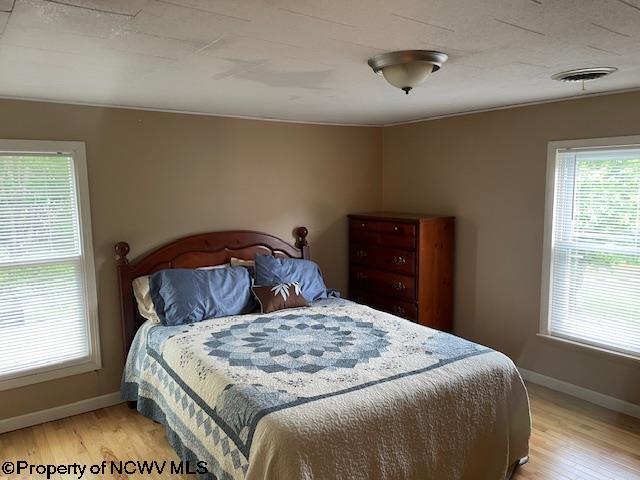 bedroom featuring light hardwood / wood-style flooring