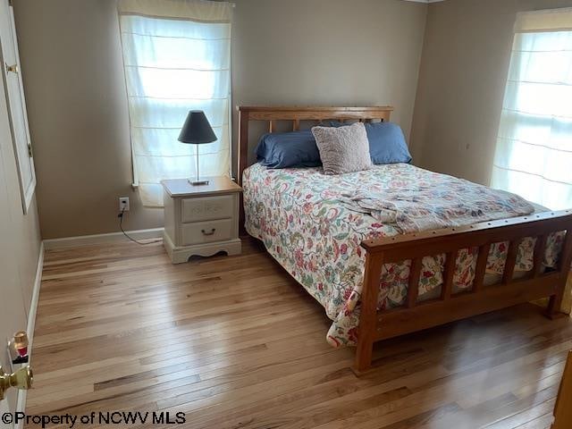 bedroom with light hardwood / wood-style floors