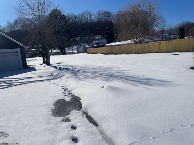 view of yard covered in snow