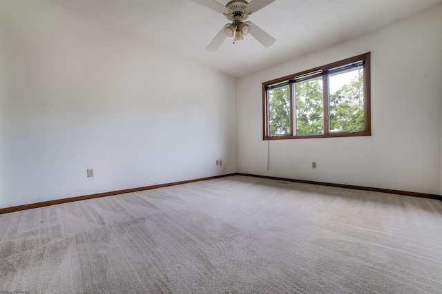 unfurnished room featuring ceiling fan and light carpet