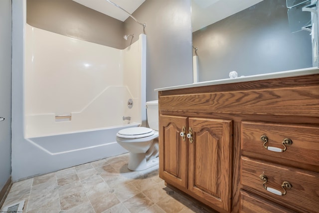 full bathroom with tile flooring, vanity with extensive cabinet space, toilet, and shower / bathtub combination