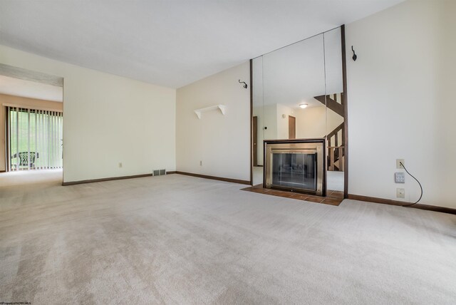 unfurnished living room with carpet