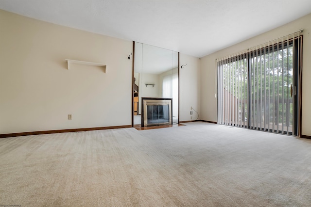 unfurnished living room with carpet