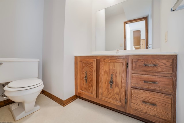 bathroom with toilet and vanity