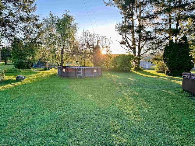 view of yard with a trampoline