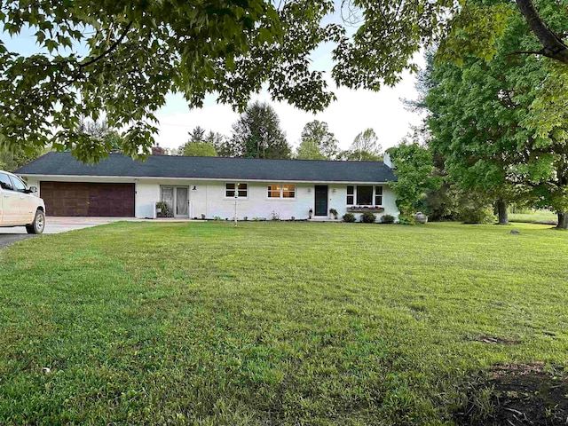 single story home with a garage and a front yard