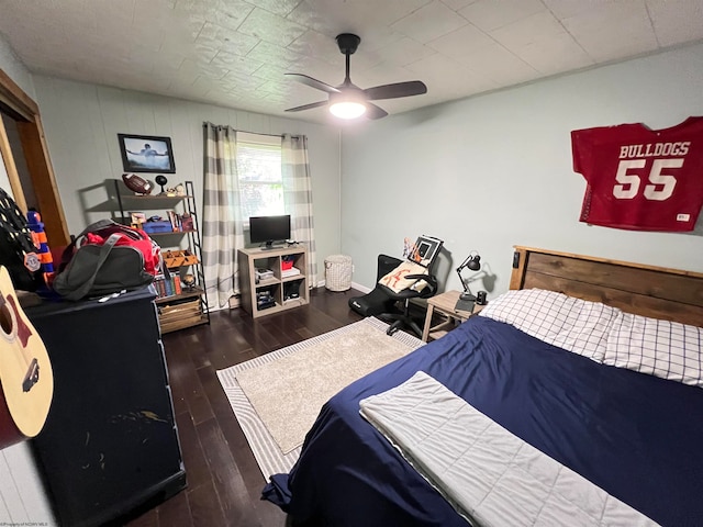 bedroom featuring dark hardwood / wood-style flooring and ceiling fan