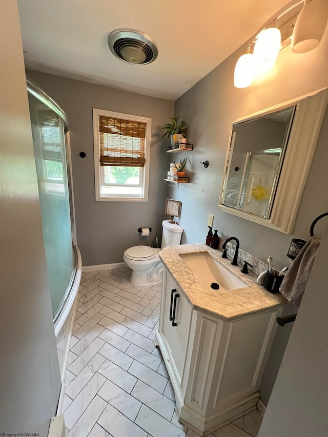 full bathroom featuring tile floors, shower / bath combination with glass door, vanity, and toilet