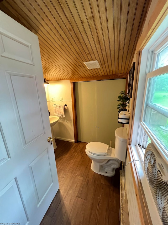 bathroom with wooden ceiling, toilet, and hardwood / wood-style flooring