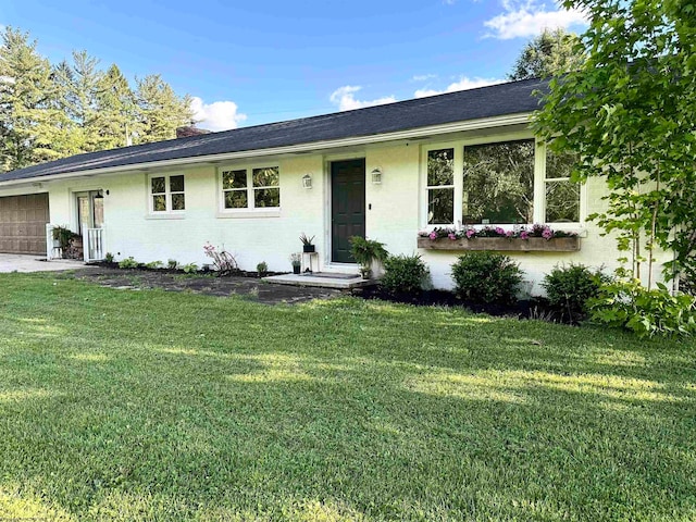 ranch-style home with a front yard