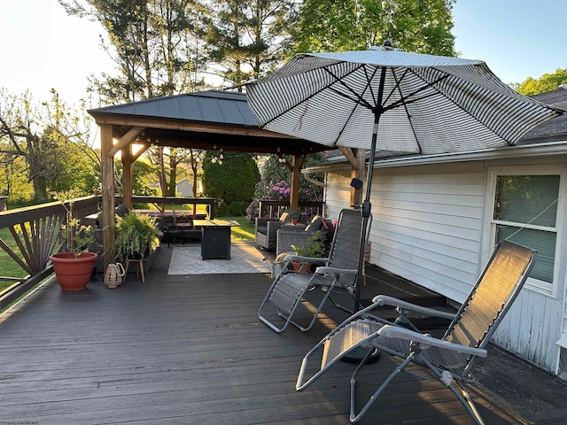 wooden terrace featuring an outdoor living space and a gazebo