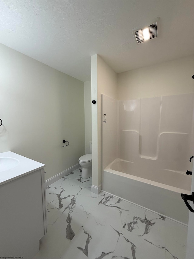 full bathroom featuring a textured ceiling, vanity, toilet, and tub / shower combination