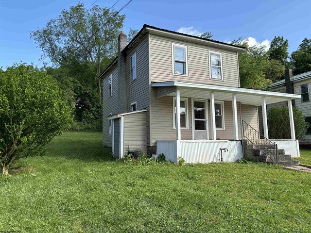 view of front property featuring a porch and a front lawn