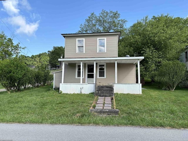 front of property with covered porch and a front yard