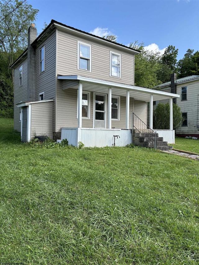 view of front of property with a porch and a front yard