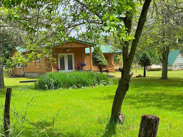 view of yard with french doors