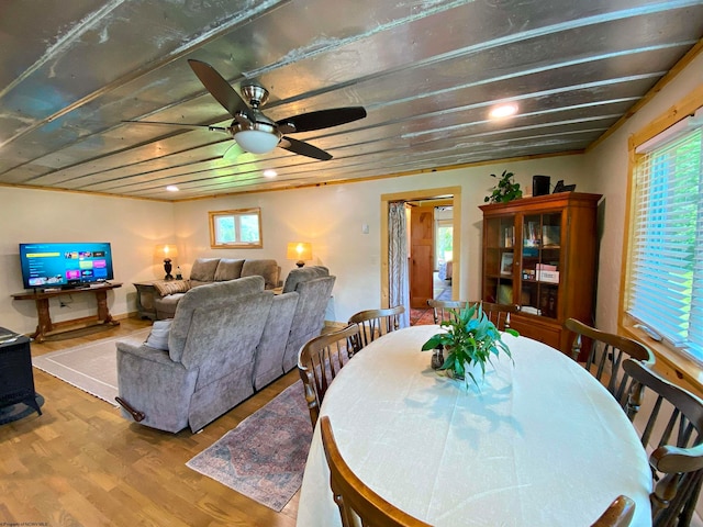 dining space featuring wood-type flooring, plenty of natural light, and ceiling fan