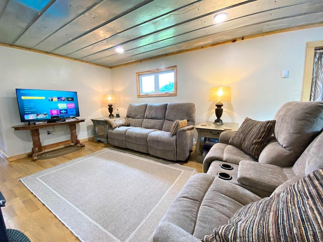 living room with wood ceiling, light hardwood / wood-style floors, and ornamental molding