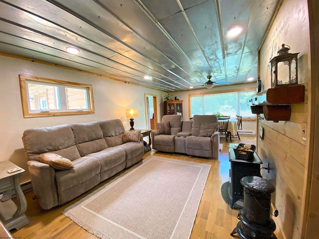 living room with ceiling fan and light hardwood / wood-style flooring