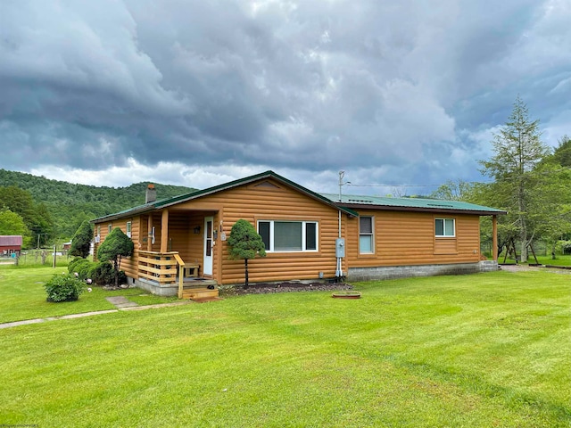 exterior space featuring a front lawn