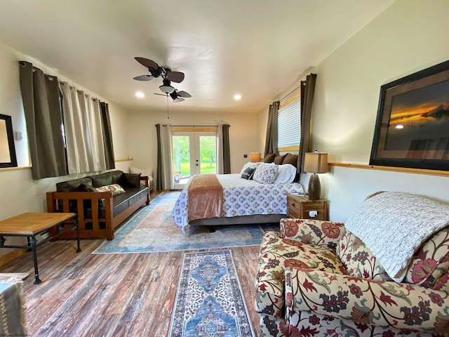 bedroom with access to exterior, hardwood / wood-style floors, french doors, and ceiling fan