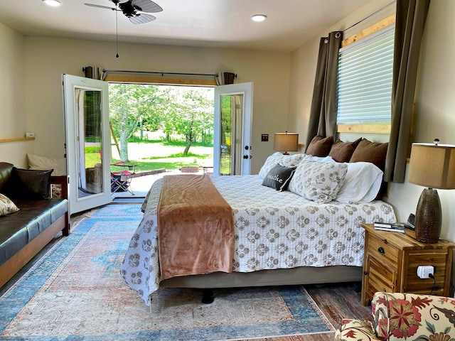 bedroom with access to outside, ceiling fan, and dark wood-type flooring