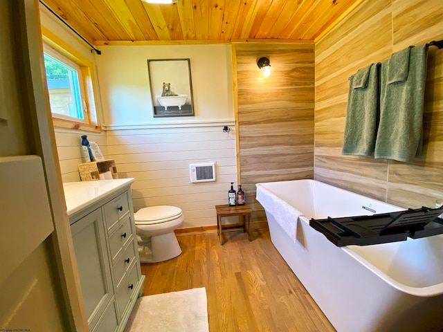 bathroom with wood walls, wood-type flooring, wood ceiling, and a tub