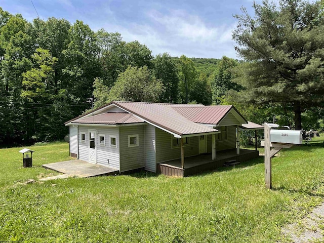 3485 Adolph Rd, Mill Creek, WV 26280 - view of outbuilding with covered porch and a wooded view
