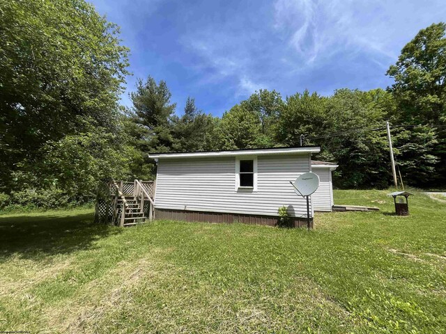 3485 Adolph Rd, Mill Creek, WV 26280 - view of side of property featuring a lawn, a deck, and stairs