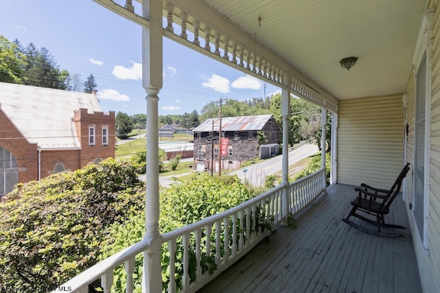 wooden deck featuring covered porch