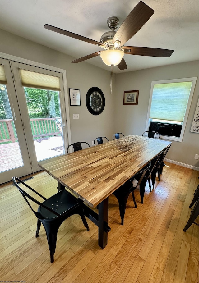 dining area featuring ceiling fan and light wood-type flooring