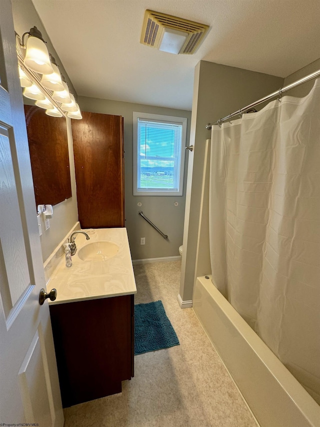 bathroom featuring vanity and shower / bath combo