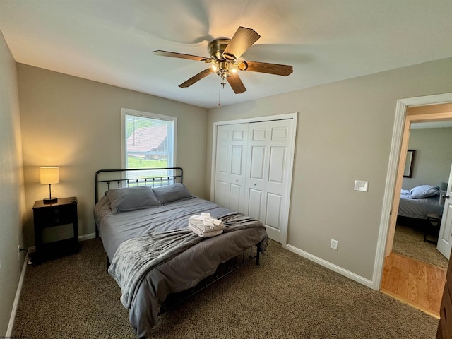 carpeted bedroom with ceiling fan and a closet