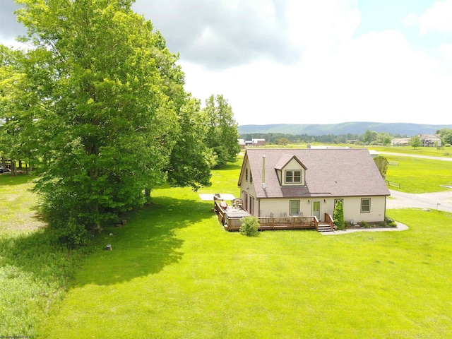 birds eye view of property featuring a mountain view