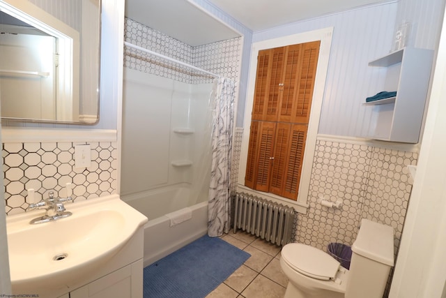 full bathroom featuring vanity, radiator, tile patterned flooring, toilet, and shower / bath combo with shower curtain