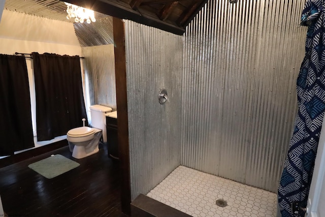 bathroom with a shower, vanity, and toilet