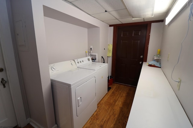 washroom with dark hardwood / wood-style flooring and independent washer and dryer