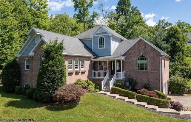 front of property featuring a porch and a front lawn