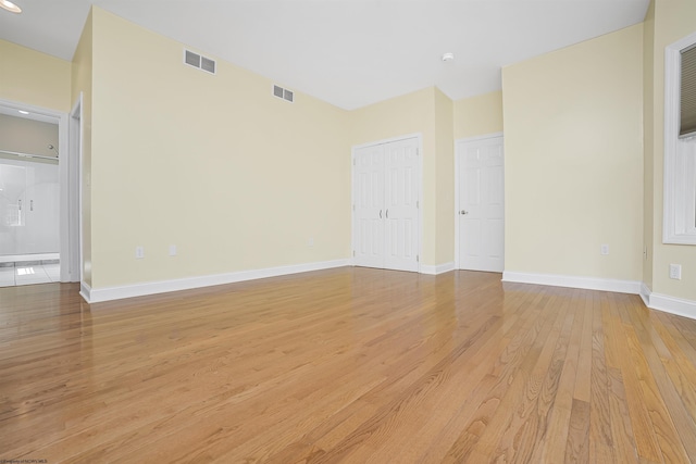 unfurnished room featuring light hardwood / wood-style floors