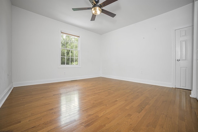 unfurnished room with hardwood / wood-style floors and ceiling fan