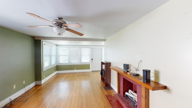 interior space with light hardwood / wood-style floors and ceiling fan