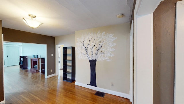 empty room with hardwood / wood-style flooring