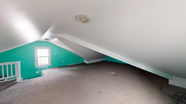 bonus room featuring carpet floors and vaulted ceiling