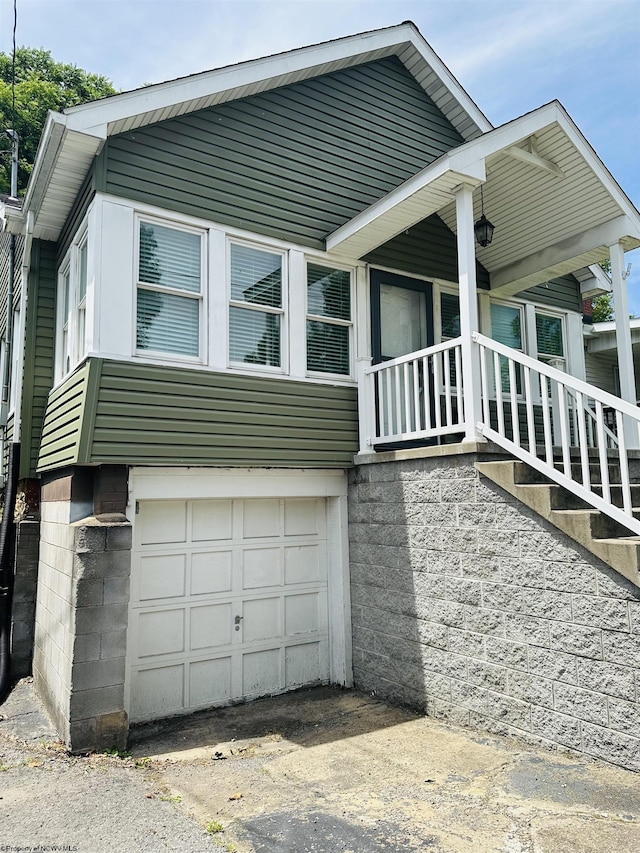 view of property exterior with a garage