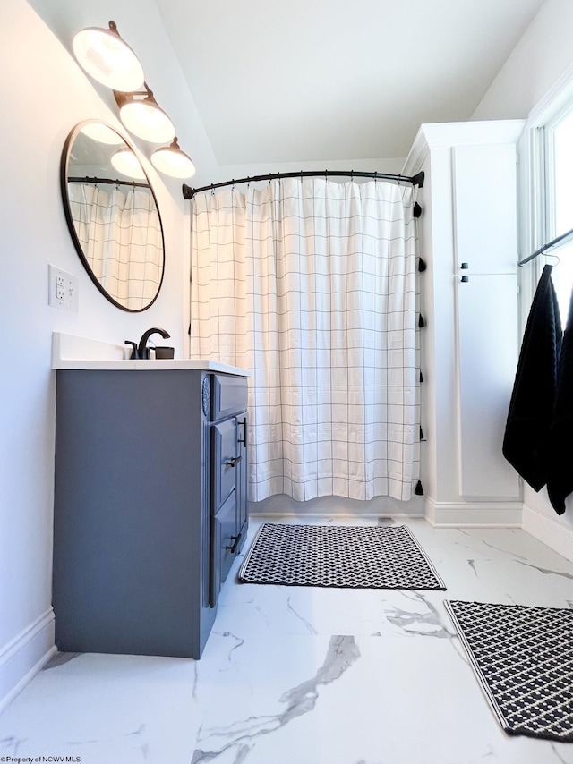 bathroom featuring vanity and walk in shower