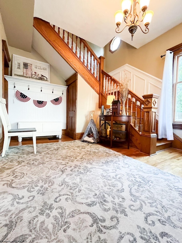 interior space with a chandelier and hardwood / wood-style floors