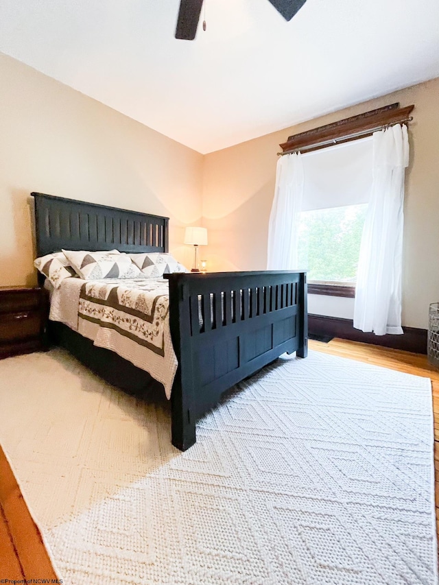 bedroom featuring ceiling fan and light hardwood / wood-style floors