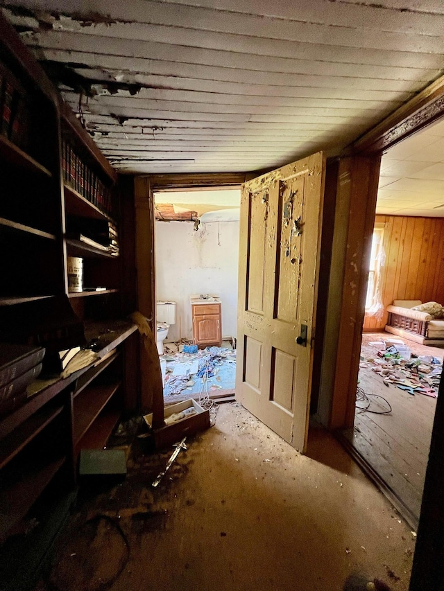 interior space featuring wooden walls