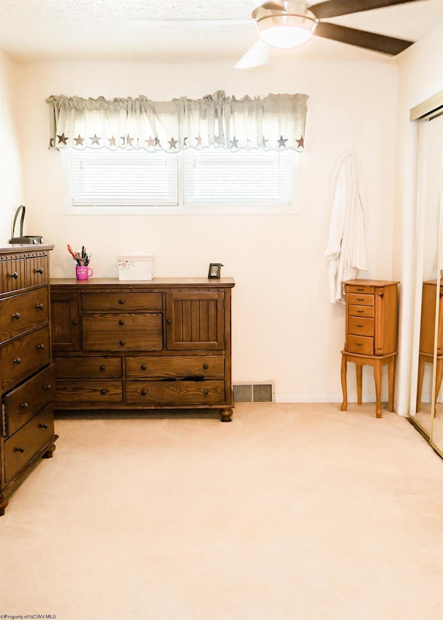 carpeted bedroom featuring ceiling fan