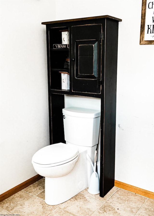 bathroom featuring tile patterned floors and toilet